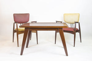 Set of 4 armchairs and a table by Michel Arnoult