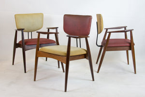 Set of 4 armchairs and a table by Michel Arnoult