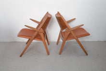 Load image into Gallery viewer, Pair of Sawbuck armchairs CH-28 by Hans J. Wegner for Carl Hansen &amp; Søn